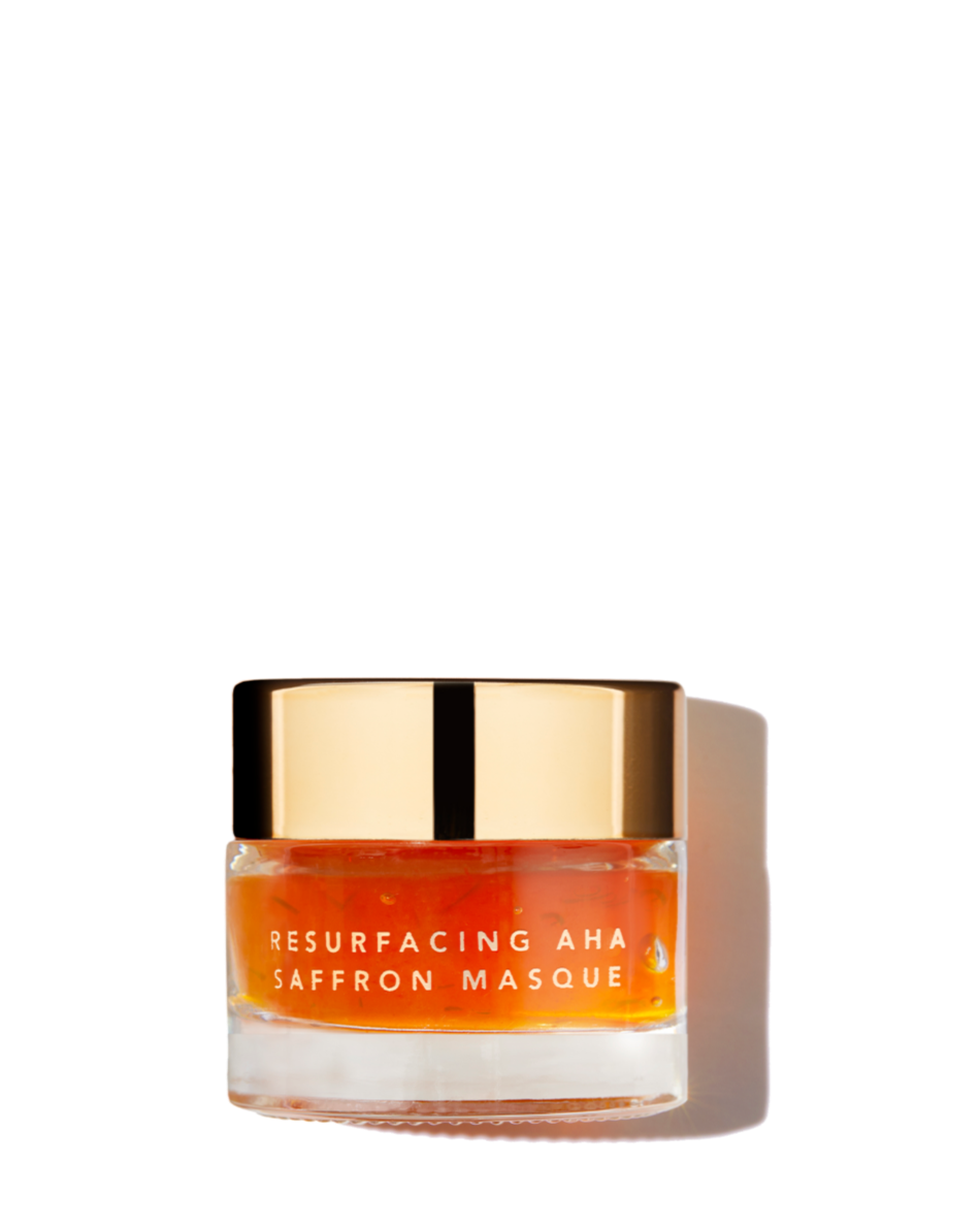 Jar of Resurfacing AHA Saffron Masque with gold lid on a white background